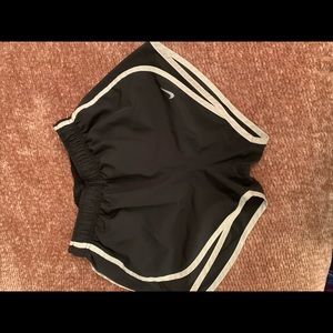 Women’s Nike Dri - Fit athletic shorts.